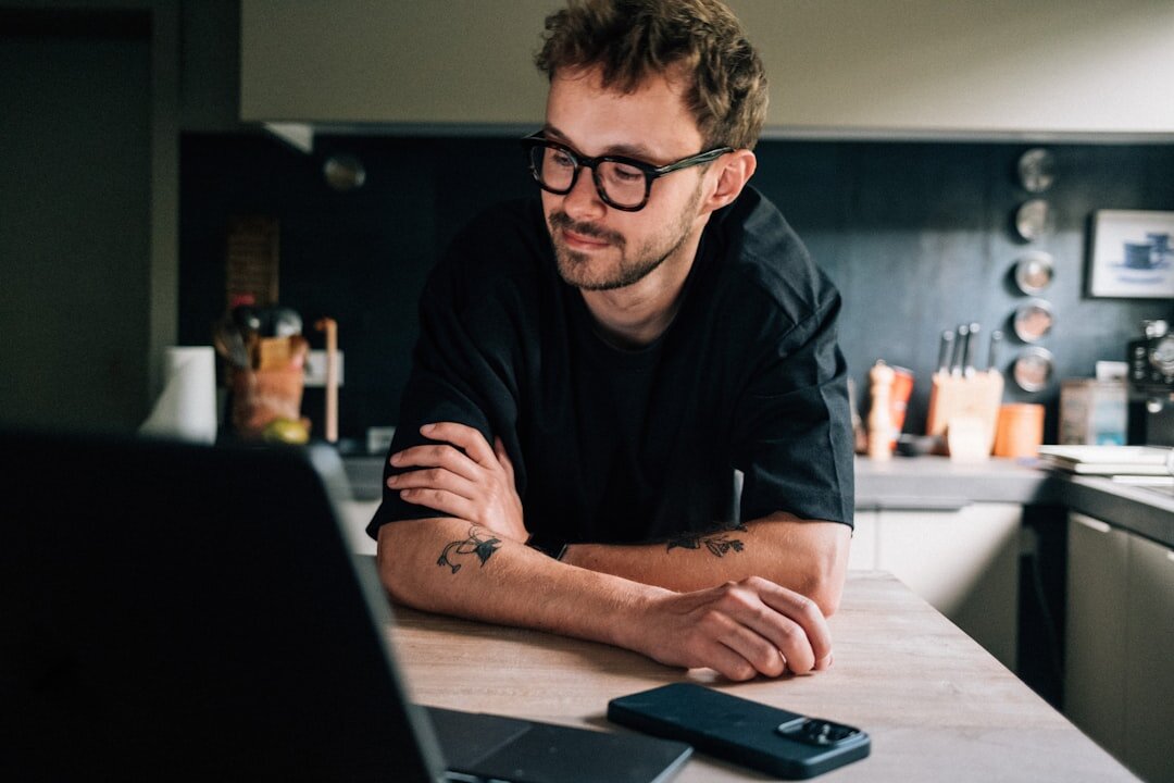 Studio portrait of a Belgian man SEO analyst with glasses